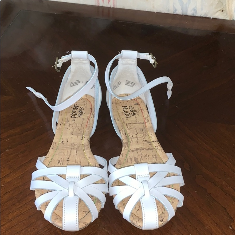 Some white sandals.